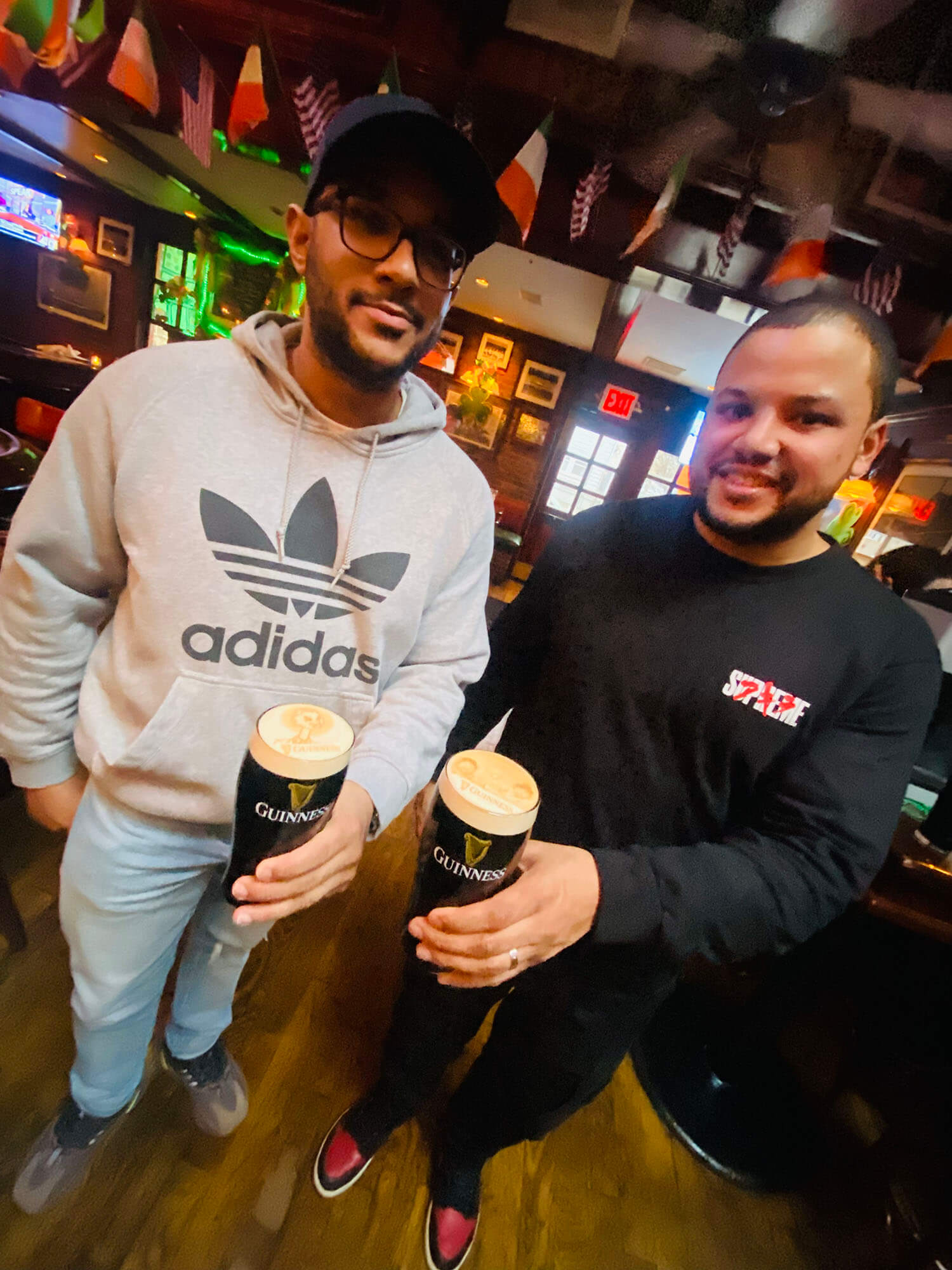 waiter and waitress holding drinks