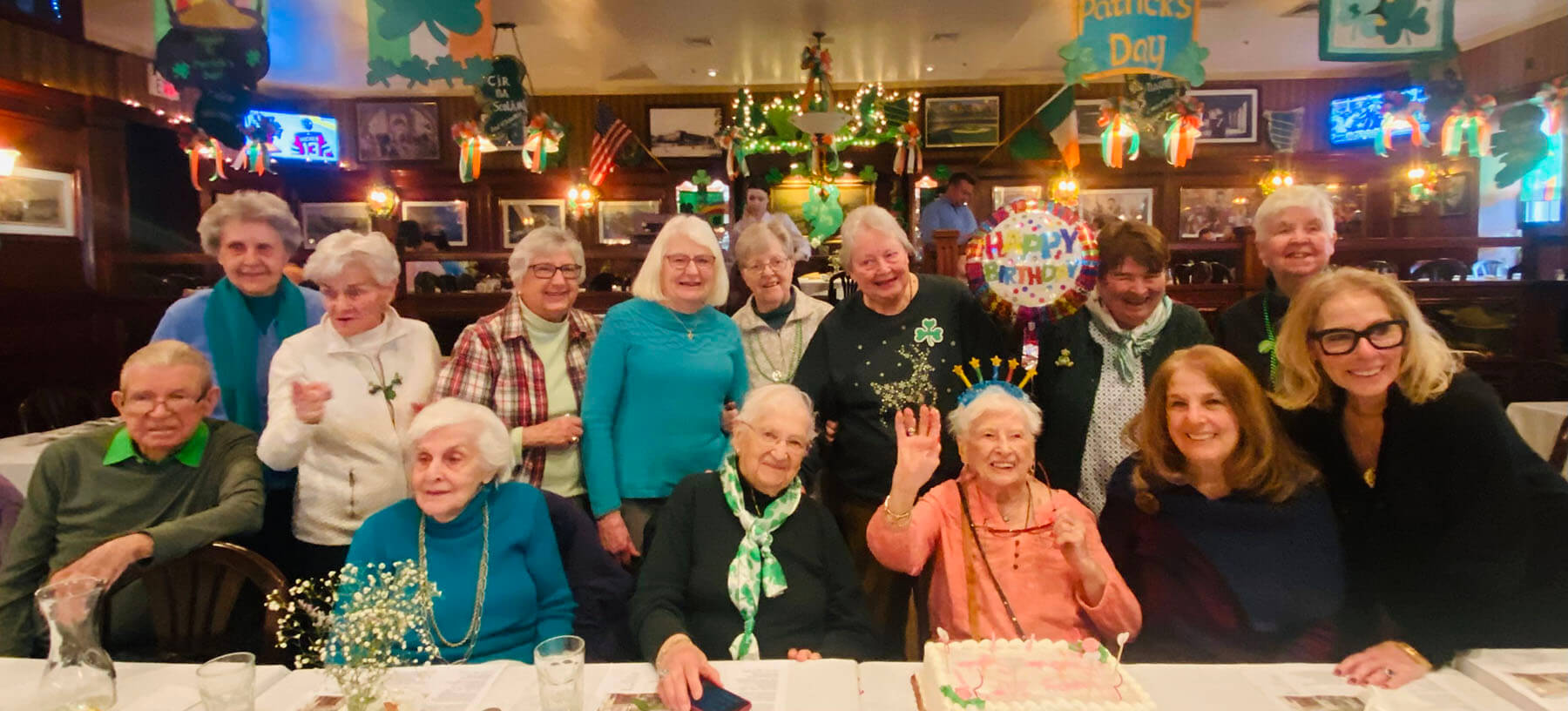 waiter and waitress holding drinks