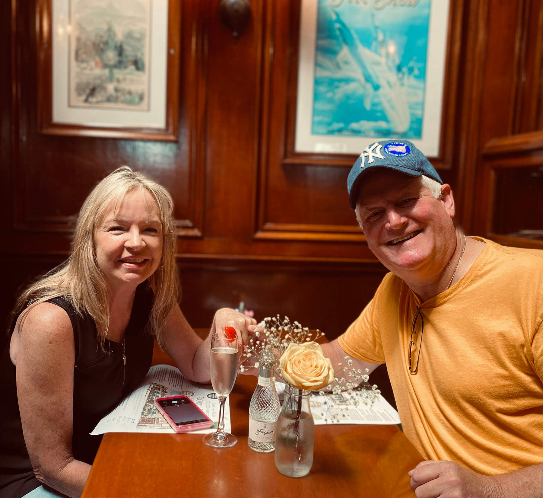 waiter and waitress holding drinks