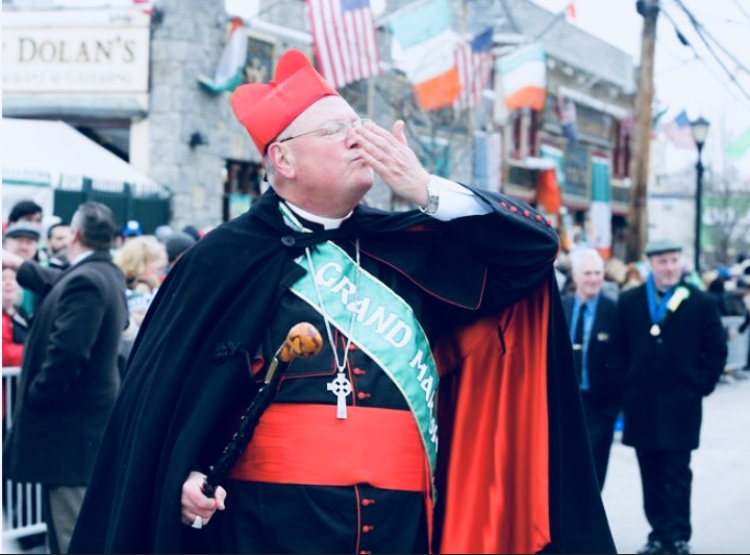 phot of irish priest marching in parade
