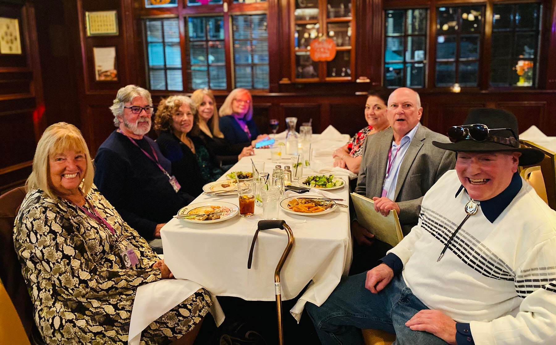 waiter and waitress holding drinks