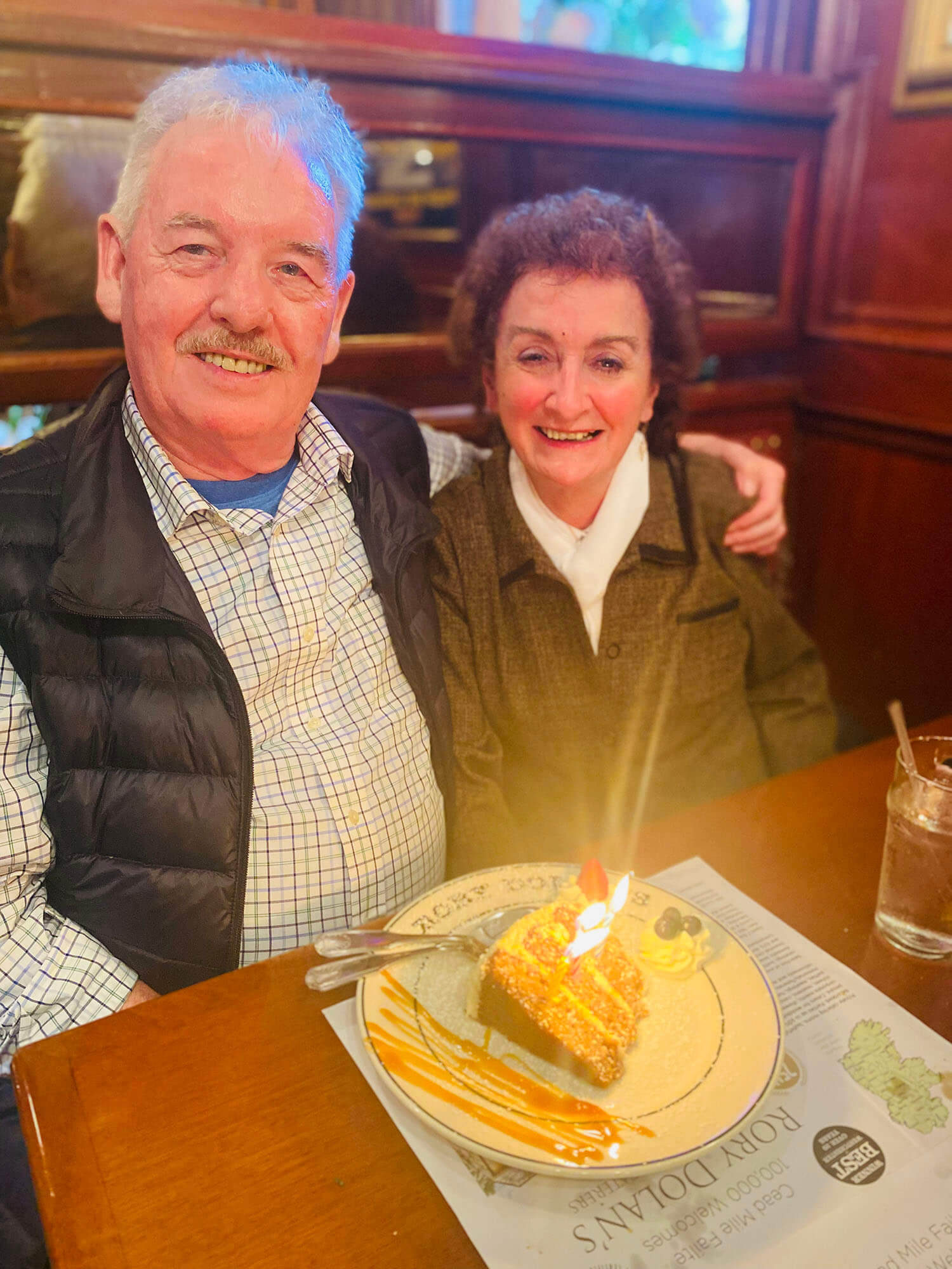 waiter and waitress holding drinks