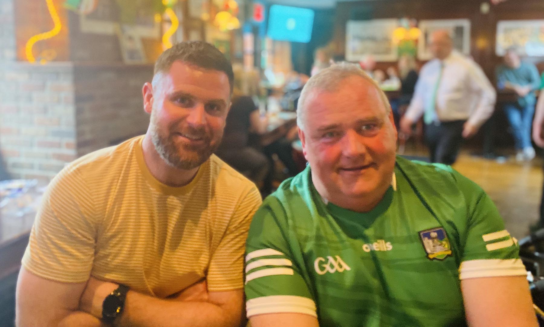 staff dressed in green hats