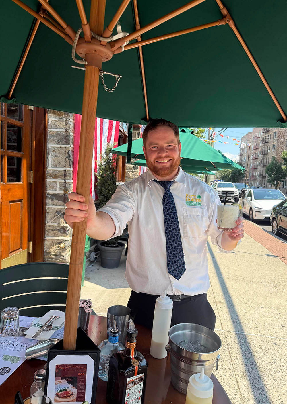 waiter and waitress holding drinks
