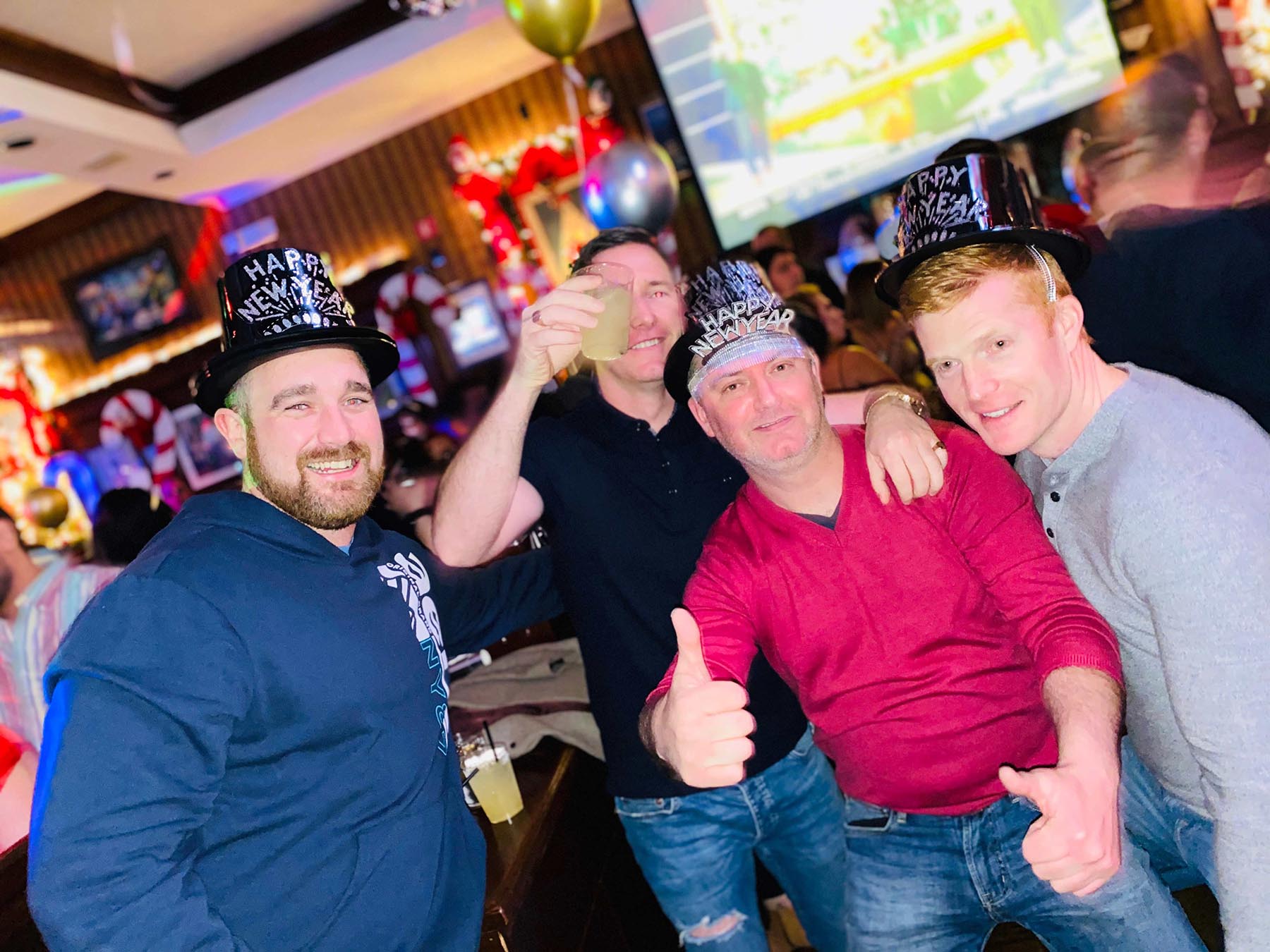 people at the bar with drinks